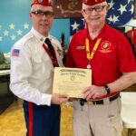 Photo of Commandant Bill Craig receiving award from National for Membership goals.